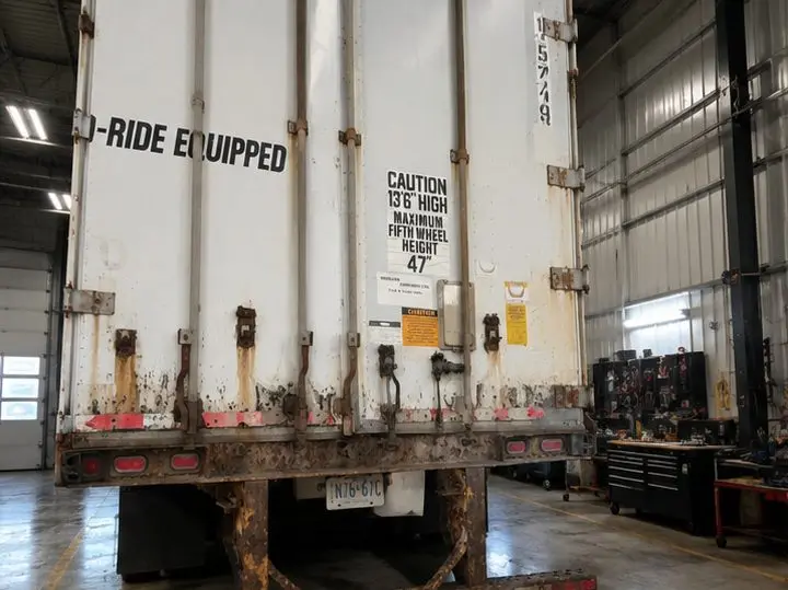 PMF rental trailer rear doors before repair at OG Trailer Repair — rusted, worn door hardware